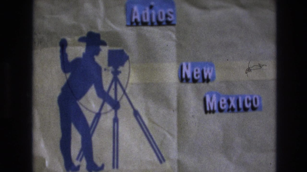 Blue Adios New Mexico card with cowboy photographer silhouette and visible film border.