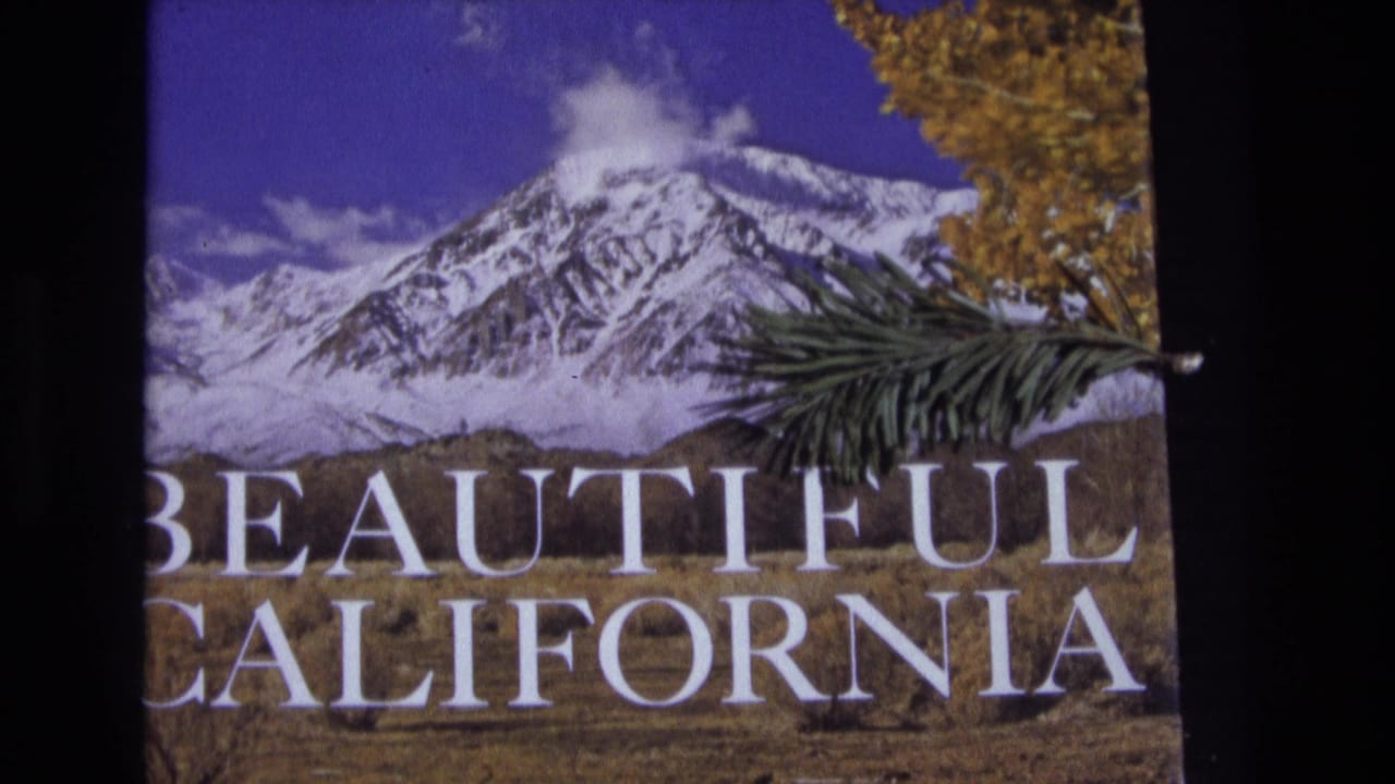 Snow-capped mountain scene with white Beautiful California lettering and autumn foliage at the edge.