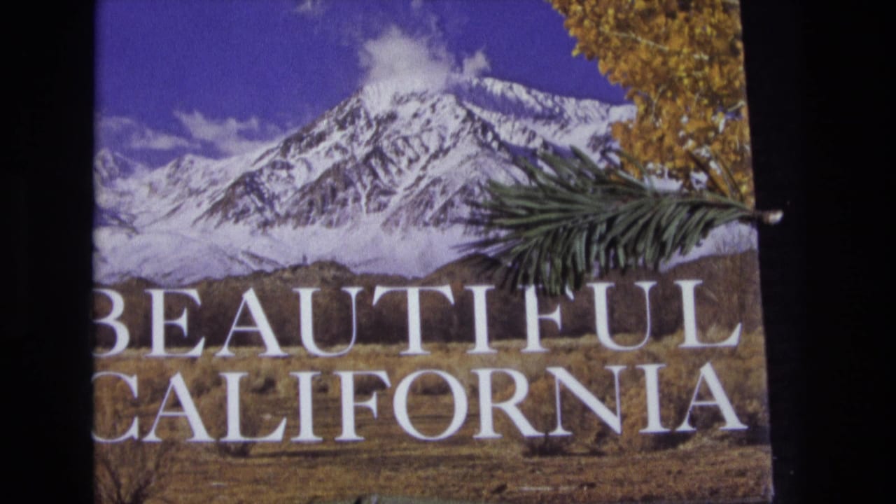 1973 8mm-style frame of a scenic California title card with a snow-covered mountain, autumn leaves, foreground pine branch, and large white Beautiful California text.