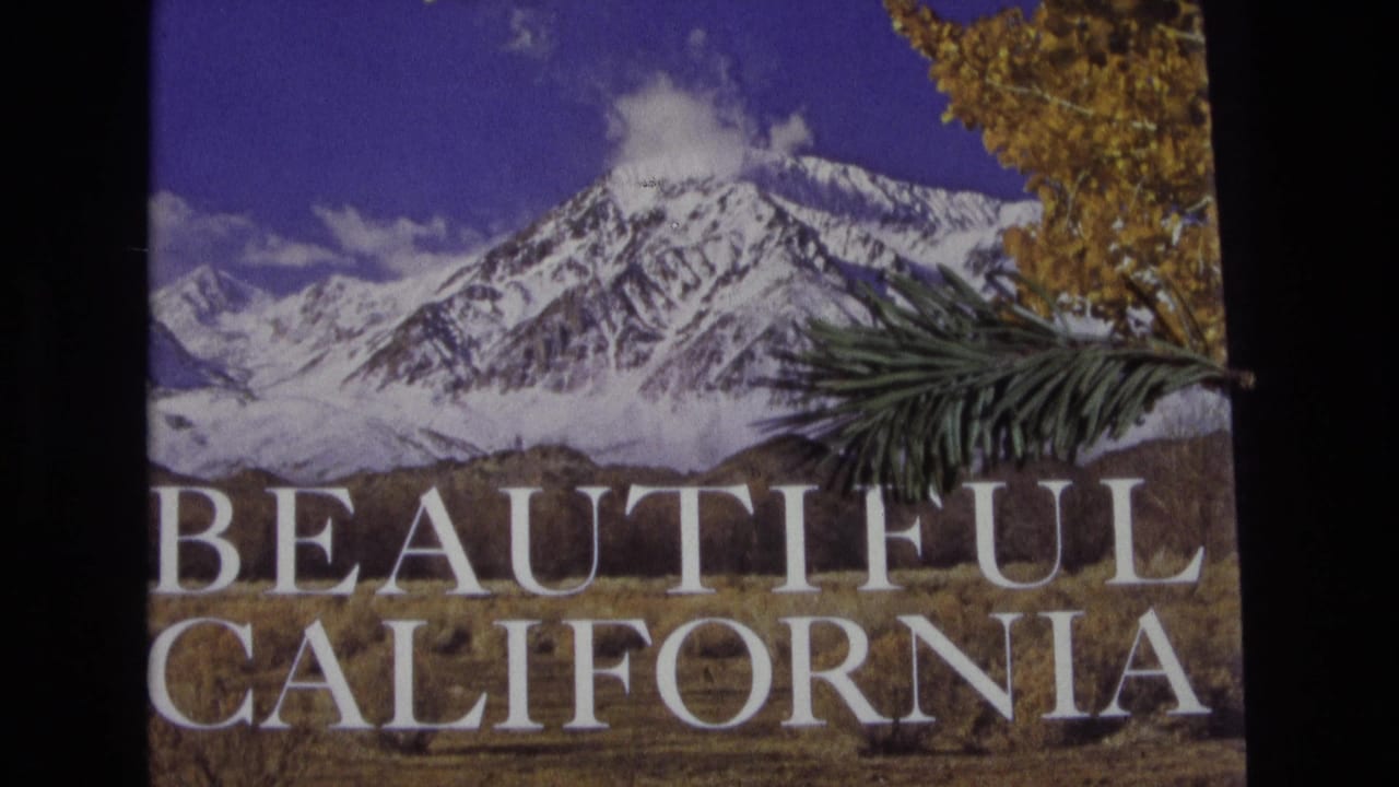 Beautiful California title card with snowy mountains, foliage, and a dark film border.