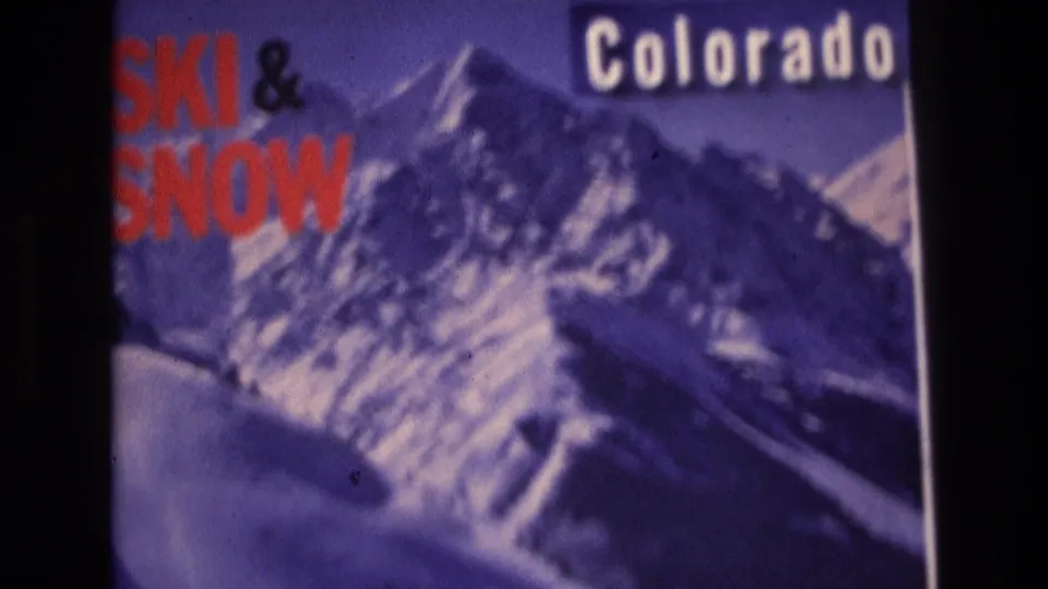 1974 Vail, Colorado frame showing the final visible view of the ski-and-snow travel poster, including red lettering, the white Colorado title, and purple-toned mountain imagery.