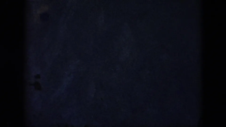 A final dark pool-water frame shows no clear swimmer, only blue-tinted water and film borders.