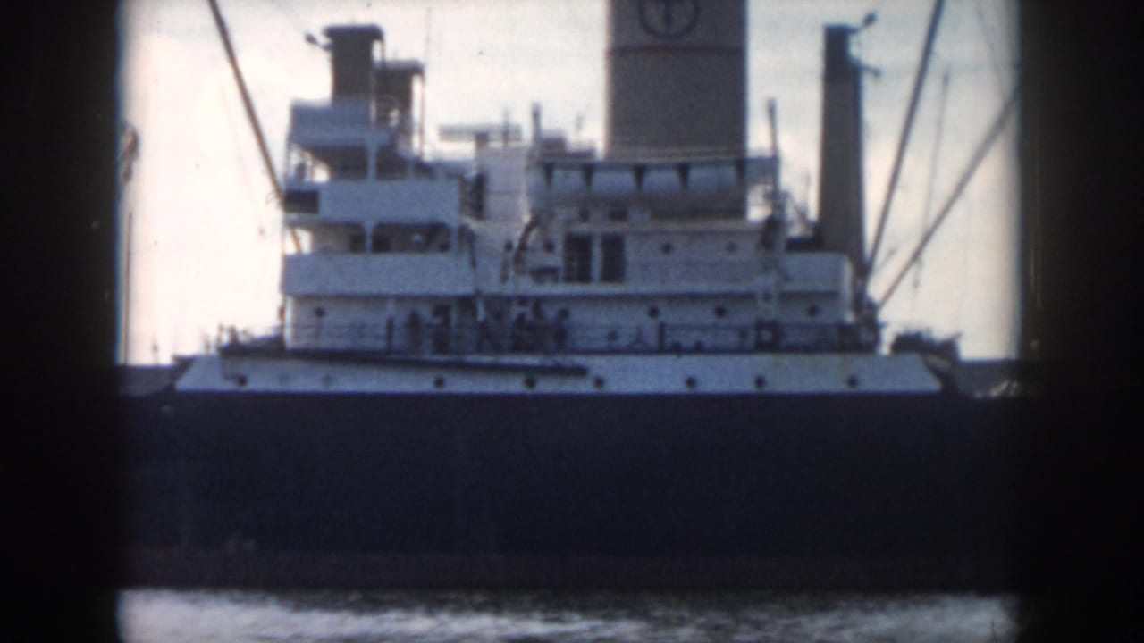 Close view of a ship's white superstructure above a dark hull.