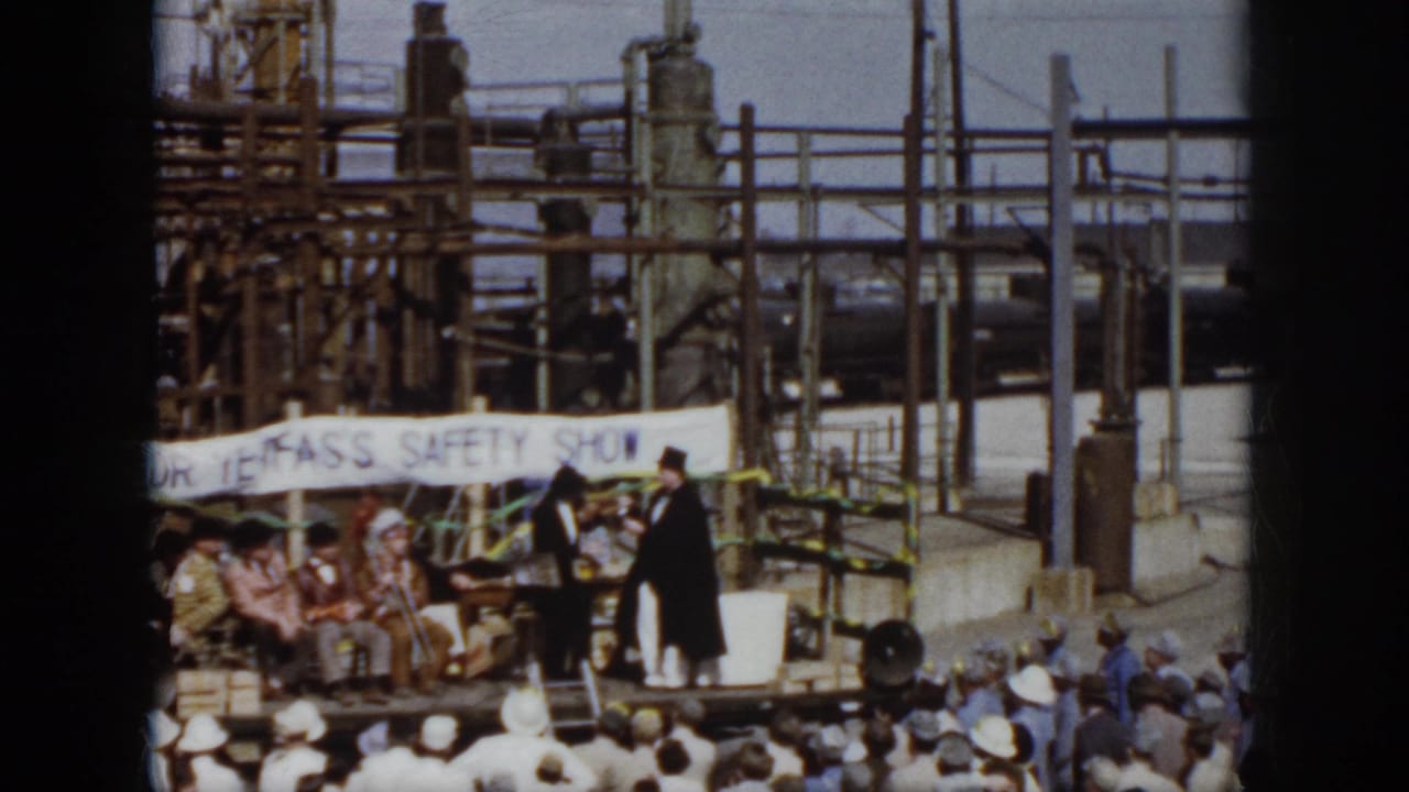 Virginia 1958 industrial safety show with costumed performers on a temporary stage before a crowd.