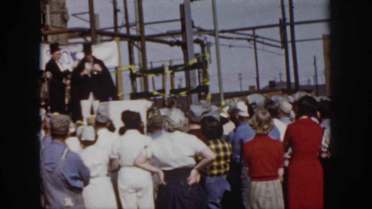 From behind the audience, two costumed men appear on a small outdoor stage beneath the VARIETY SHOW banner in Virginia, 1958.