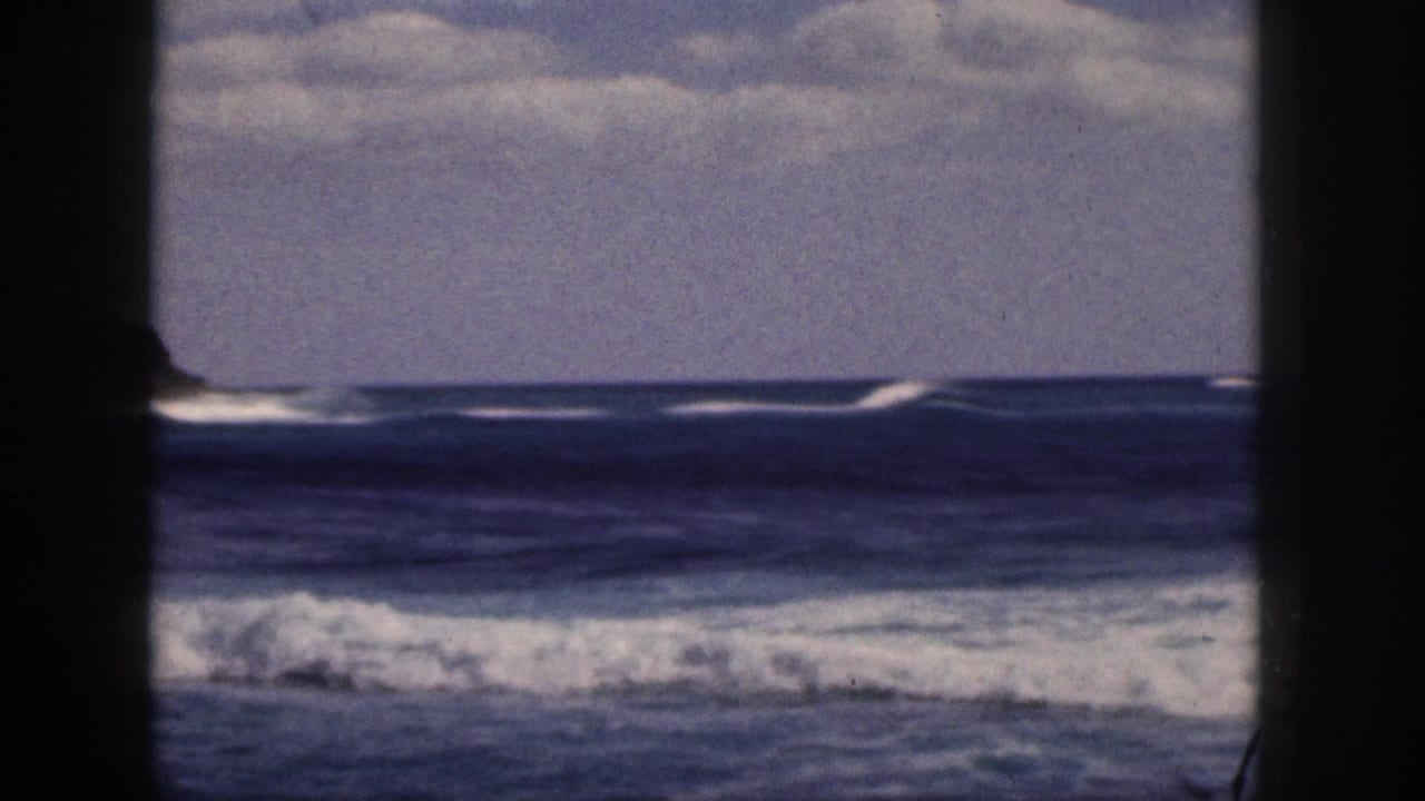 Distant waves and horizon divided by a dark central frame post.
