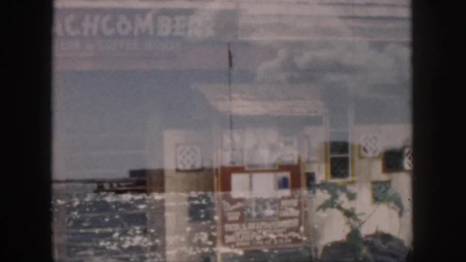 1959 Hawaii frame with a small shoreline structure and open water, overlaid by faint Don the Beachcomber signage.