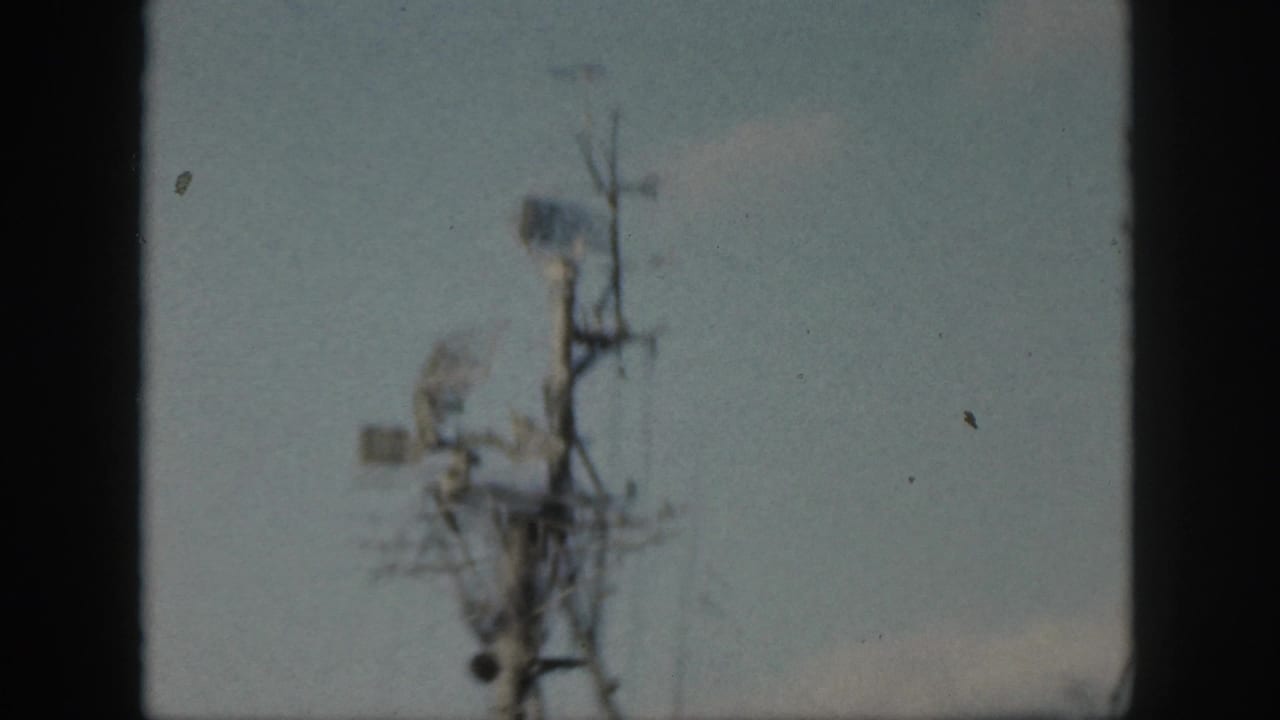 Soft view of a ship mast with radar and antenna equipment.