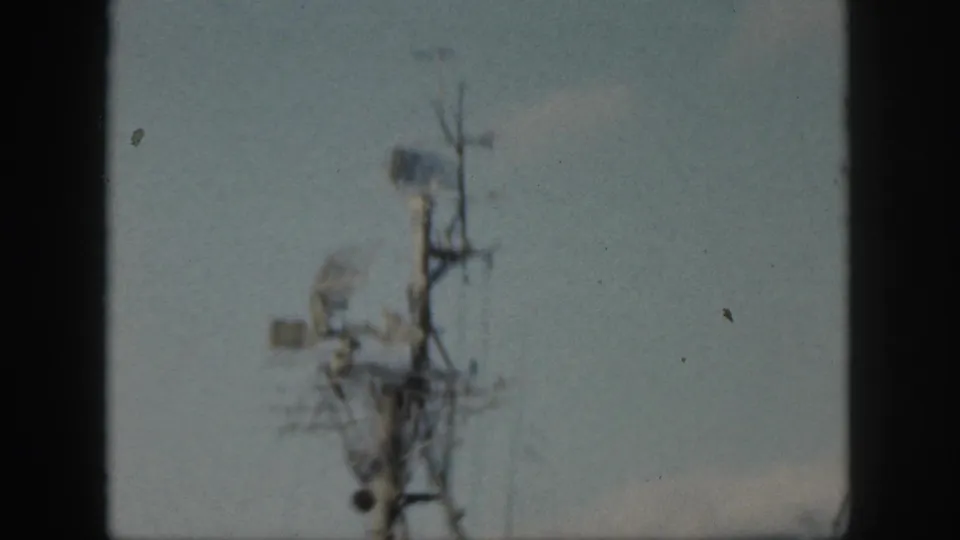 Color 8mm frame from Oahu, Hawaii, showing a military ship mast with radar and communications gear.