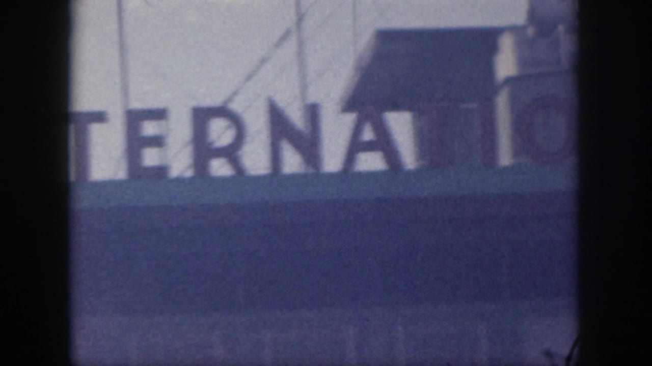 Final frame shows cropped INTERNATIONAL lettering with roof structures and film borders in the 1959 Honolulu airport sign shot.