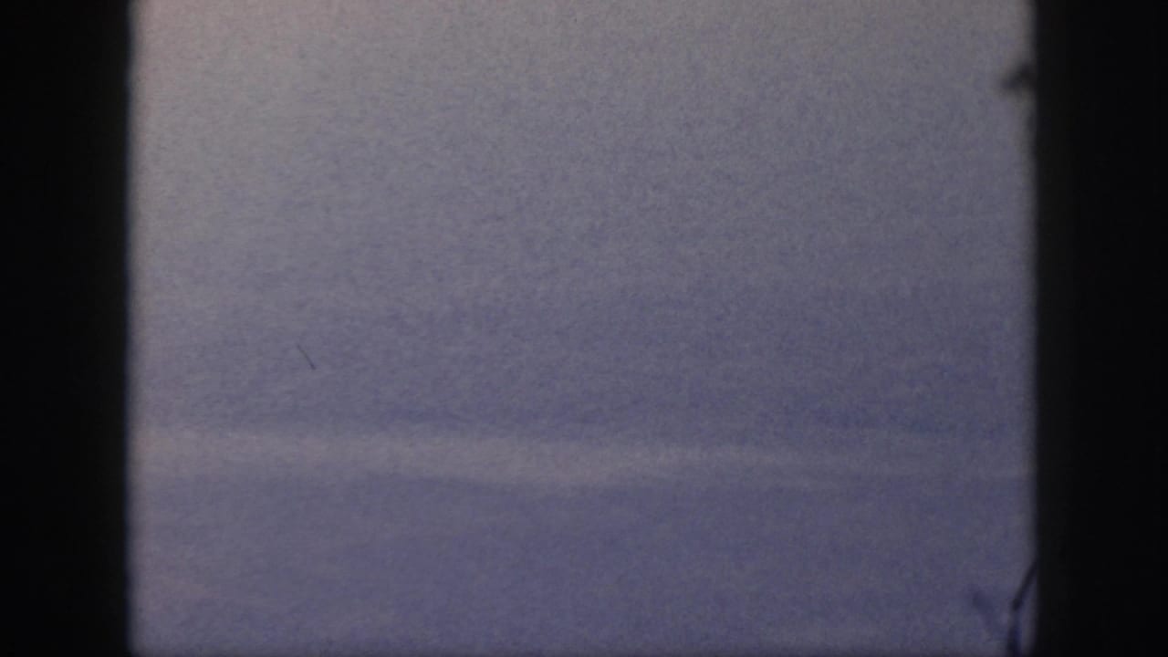 Hazy sky with a dark vertical strip dividing the frame.