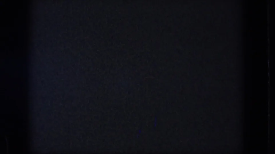 The final contact-sheet frame is mostly dark and underexposed, with film texture visible but no clear subject detail.