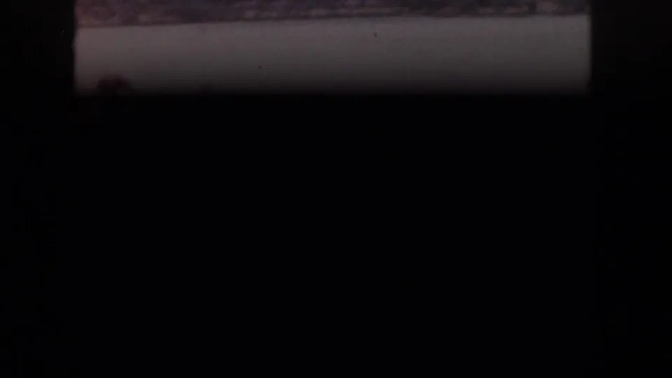 The contact sheet shows a mostly dark frame area, with a narrow strip of the 1961 Michigan lake scene visible above.