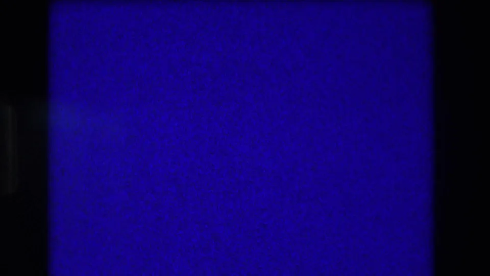 End frame from the 1973 Medford clip with heavy blue-purple exposure and no clear human subject visible.