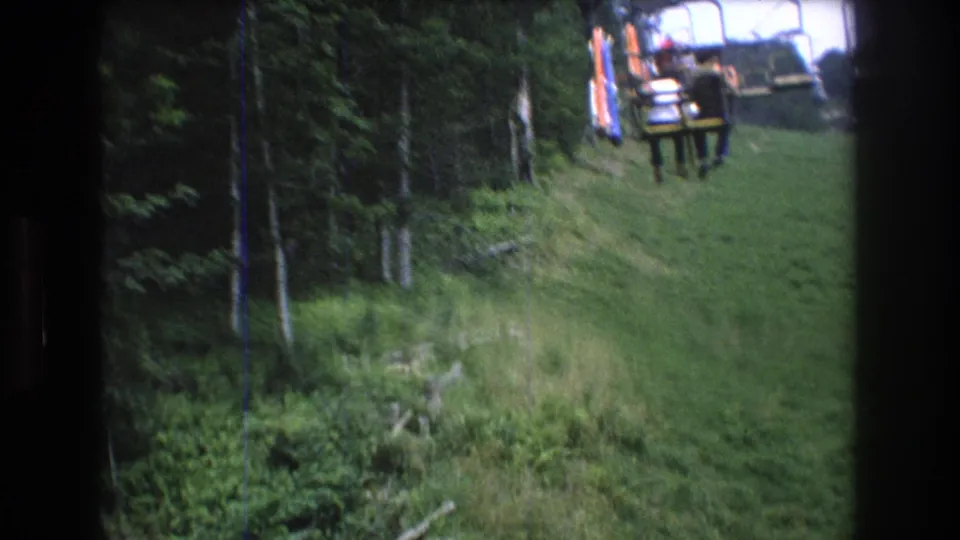 The final frame shows riders on a chairlift above a grassy Mt Bromley slope, with forest, fallen wood, and visible Super 8 frame edges.