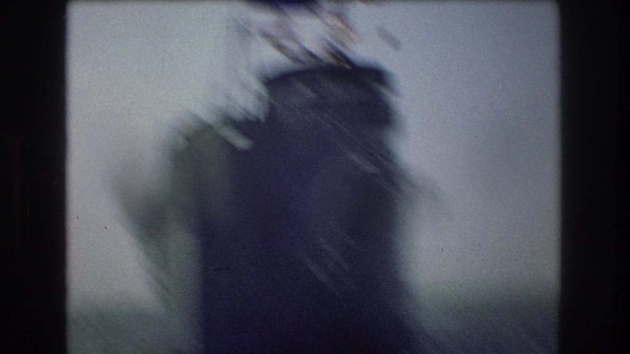 Blurred close view of a ship structure with dark film border.