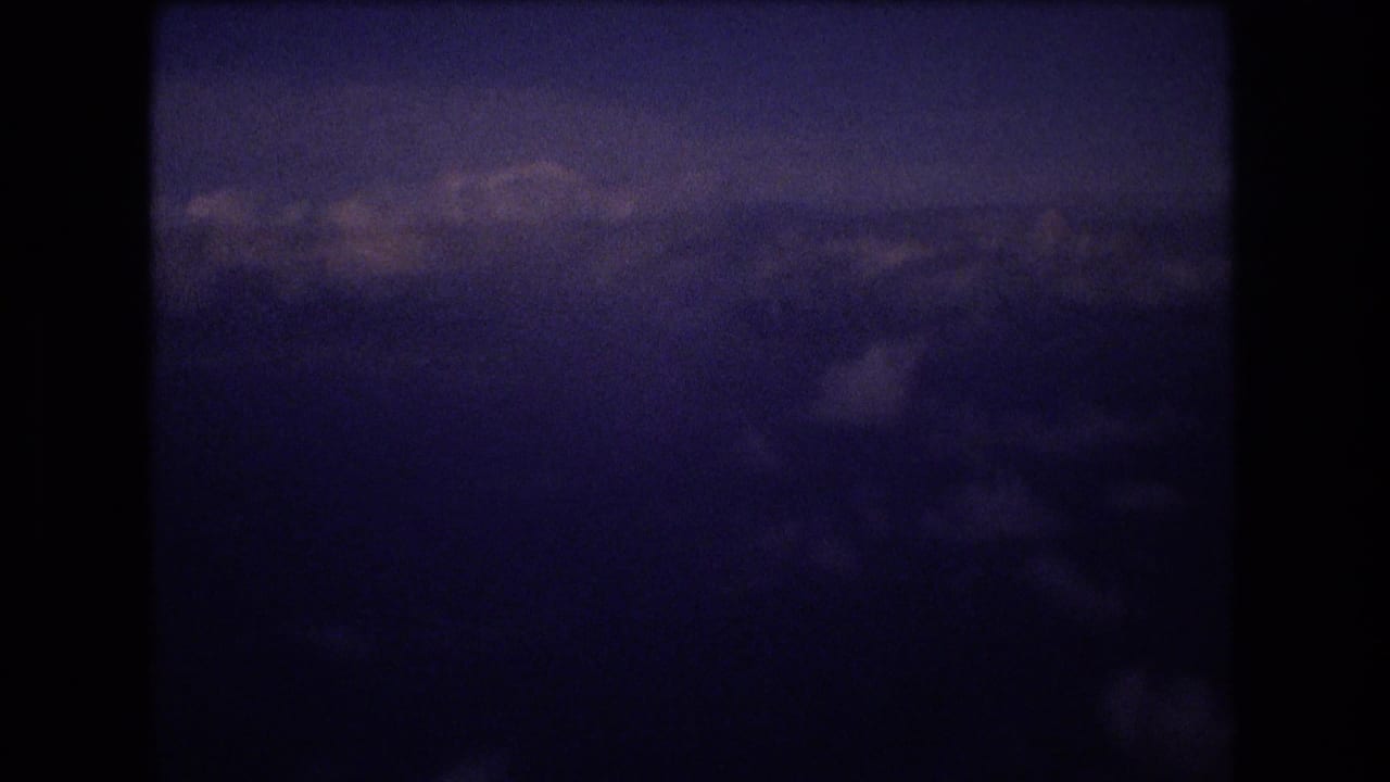 Clouds and sky seen from a high-altitude airplane view.