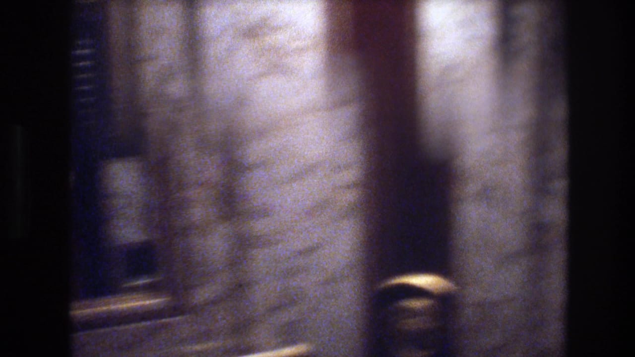 8mm close-up of marble-clad columns with gold hardware in a Las Vegas casino hotel lobby, circa 1977.