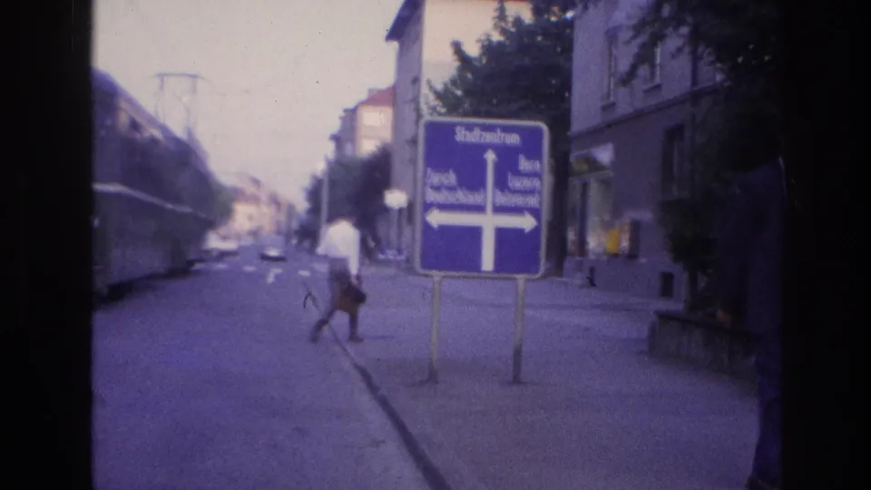Blue directional sign reading 'Stadtzentrum' at a street junction; metadata describes this as France 1967 but sign text is in German, suggesting Alsace or a bordering region.