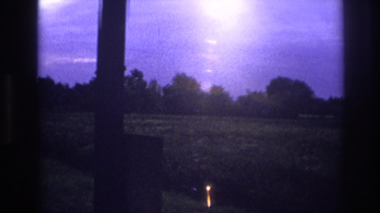 Rural landscape through window frame, intense white light bloom upper right, small orange point of light in field, purple sky, 8mm.