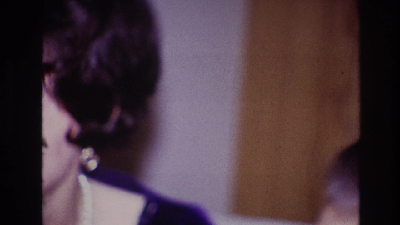 Partial close-up of the woman beside a dark vertical film edge.