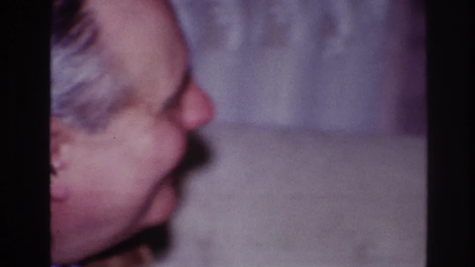 At the end of the 1967 Ottawa clip, the older man appears to laugh or smile broadly in a soft indoor profile shot.