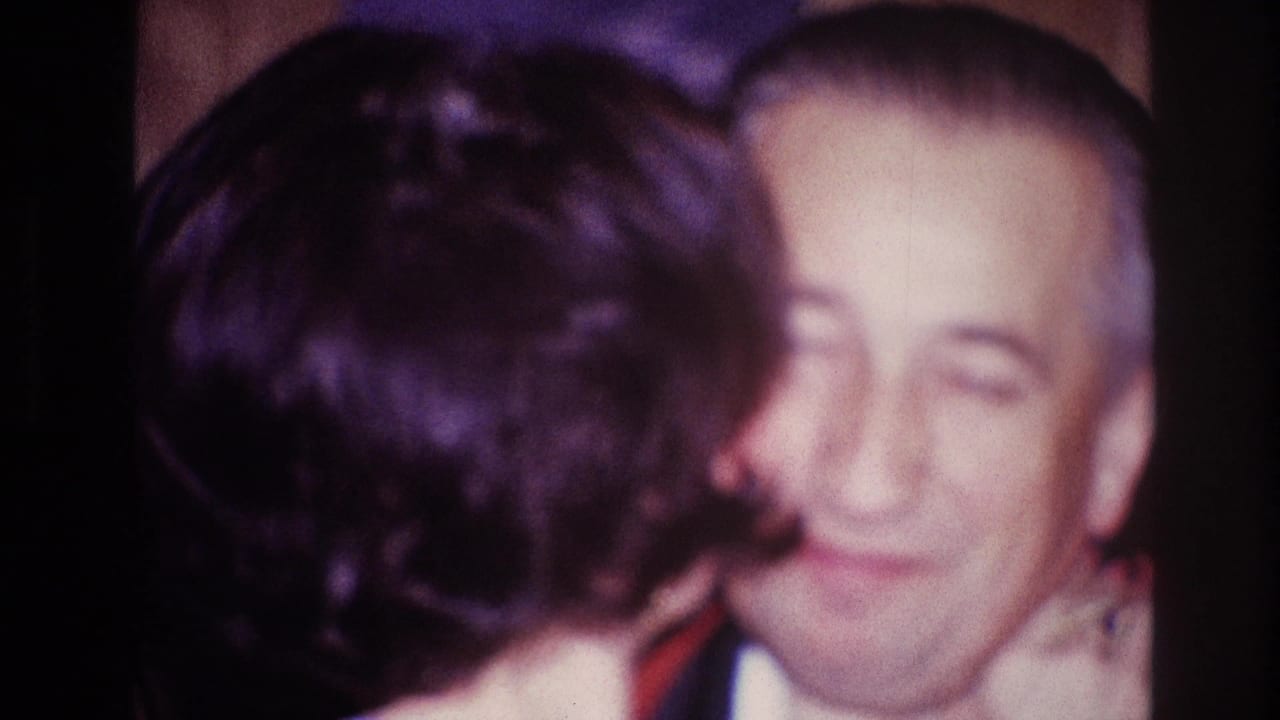 In 1967 Ottawa home-movie footage, an older man smiles while dancing closely with a woman seen from behind.