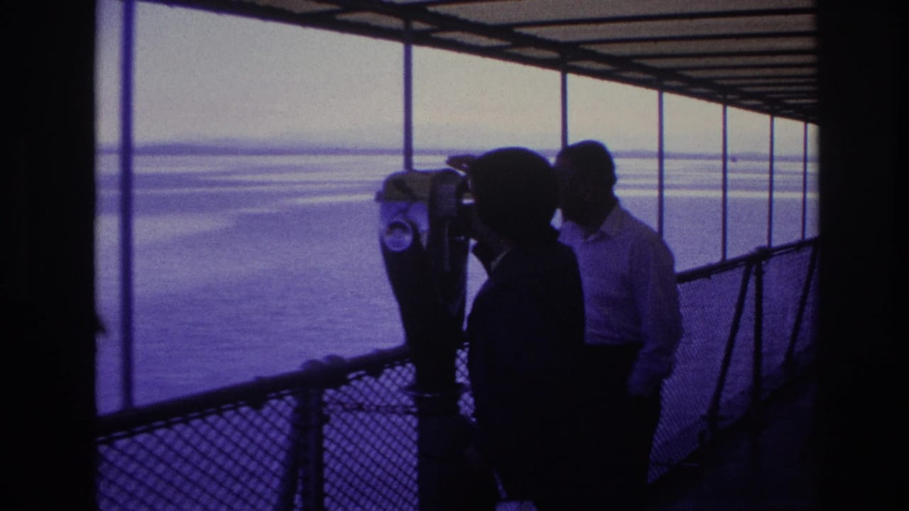 1967 Ottawa frame with silhouetted tourists gathered around a coin-operated binocular viewer overlooking broad water.