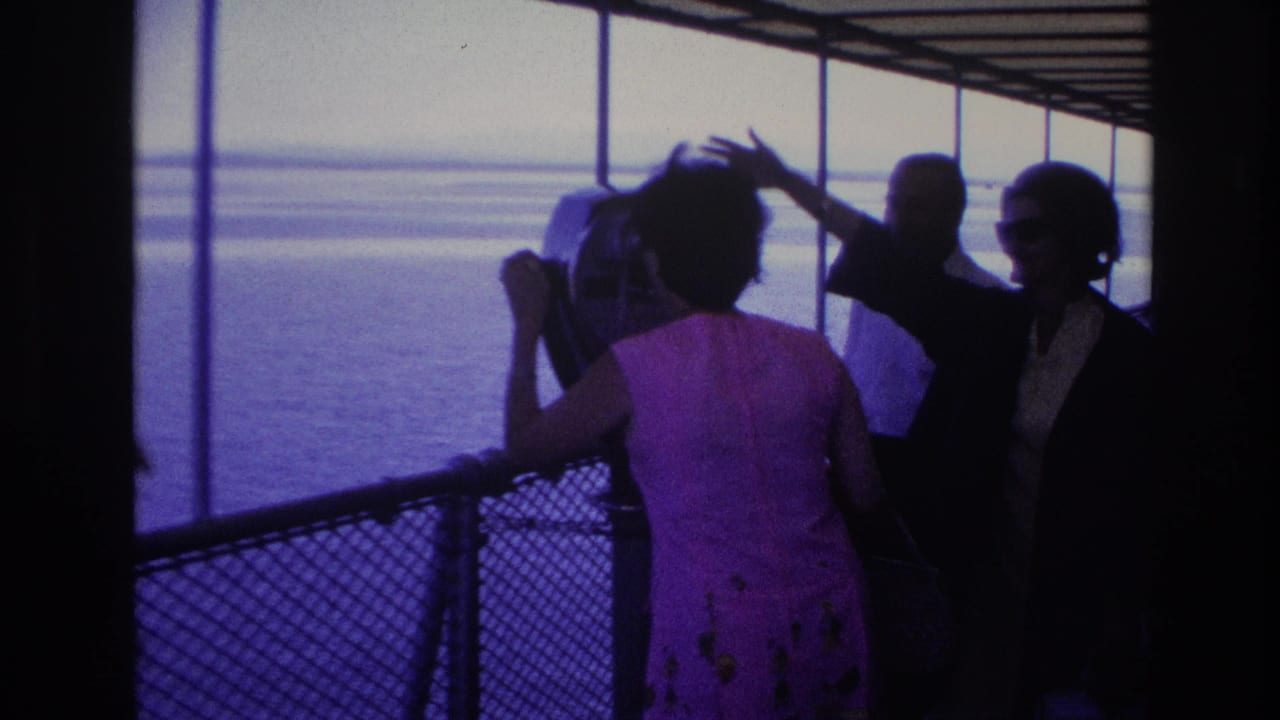 1967 Ottawa boat tour scene with a woman in a pink floral dress at a binocular viewer while adults stand near the railing and water beyond.