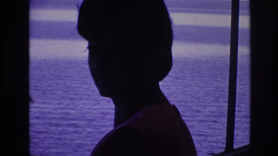 A woman appears in dark profile against bright water in the supplied 1967 Ottawa boat-trip footage.