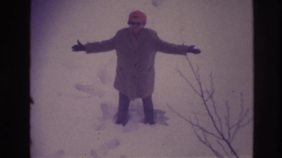 A woman in Ottawa winter snow, dated by metadata to 1967, holds her arms out as if keeping balance in deep snow.