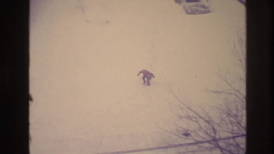 In the final faded frame, the man bends or crouches in the Ottawa snow, with bare branches visible at the lower right.