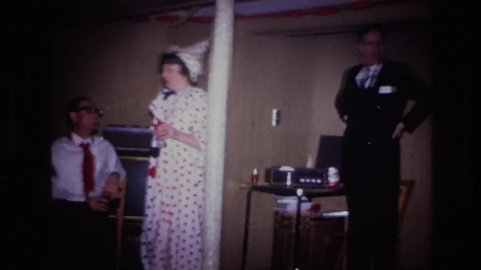 The Ottawa party scene shows a woman in polka-dot costume, a seated man, and a suited man standing near tabletop equipment.