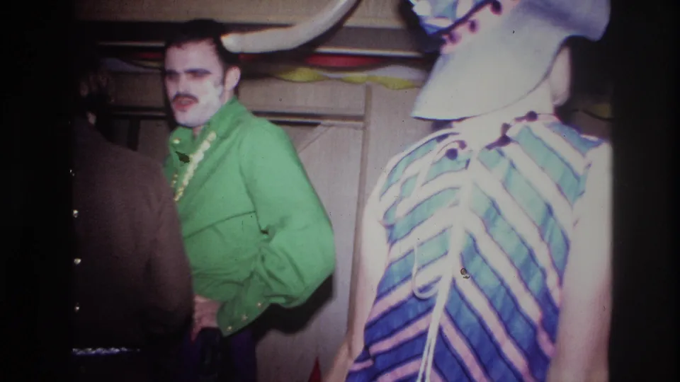 A 1967 Ottawa party frame shows a man in a bright green shirt beside a person in a striped dress, with other adults partly visible nearby.