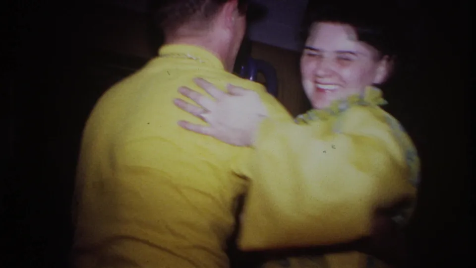 The Ottawa party footage shows the couple mid-dance, the woman smiling while holding the man against a wood-paneled interior.