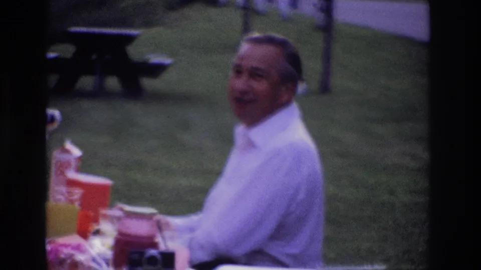 The 1967 Ottawa picnic scene shows a man seated near cups and containers, with grass and a wooden bench in the background.