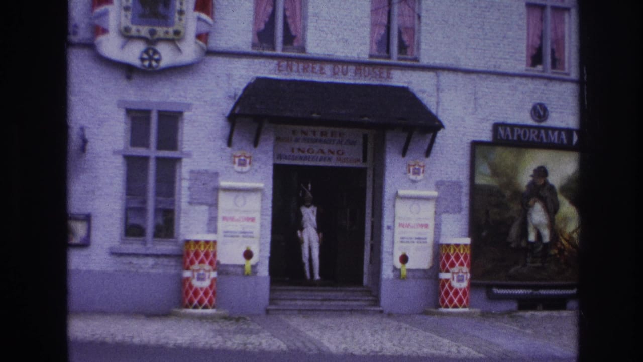 Closer view of the museum doorway, mannequin, Naporama sign, poster, and French entrance text.