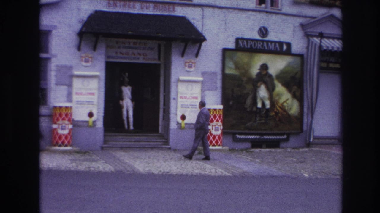 1967 Paris street view showing a museum entrance, Naporama poster, white mannequin display, and a man walking along the sidewalk.