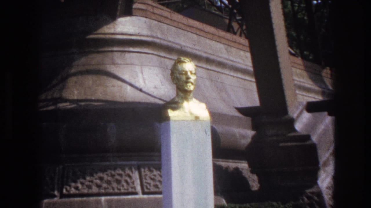Golden bust and pedestal framed closer beside stone monument details.