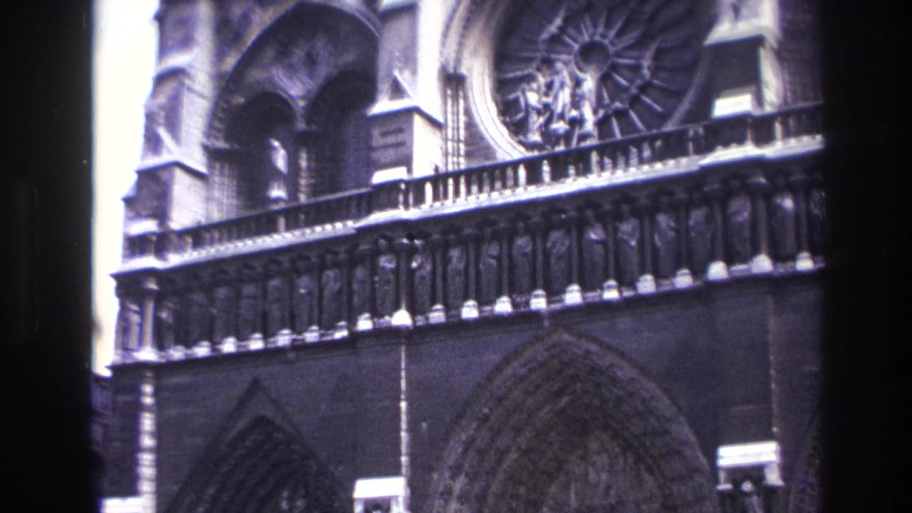 Notre-Dame rose window and upper facade details.