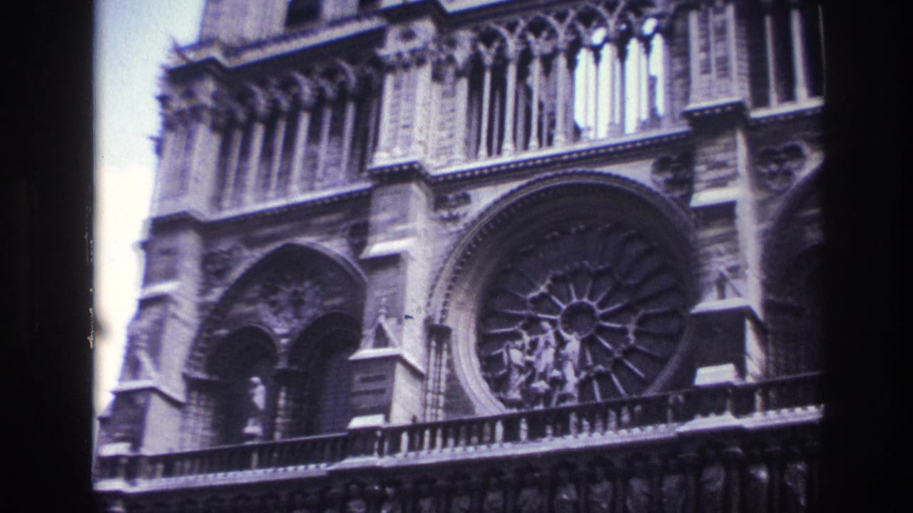 1967 Paris frame of Notre-Dame Cathedral exterior, centered on the rose window and surrounding Gothic arches.