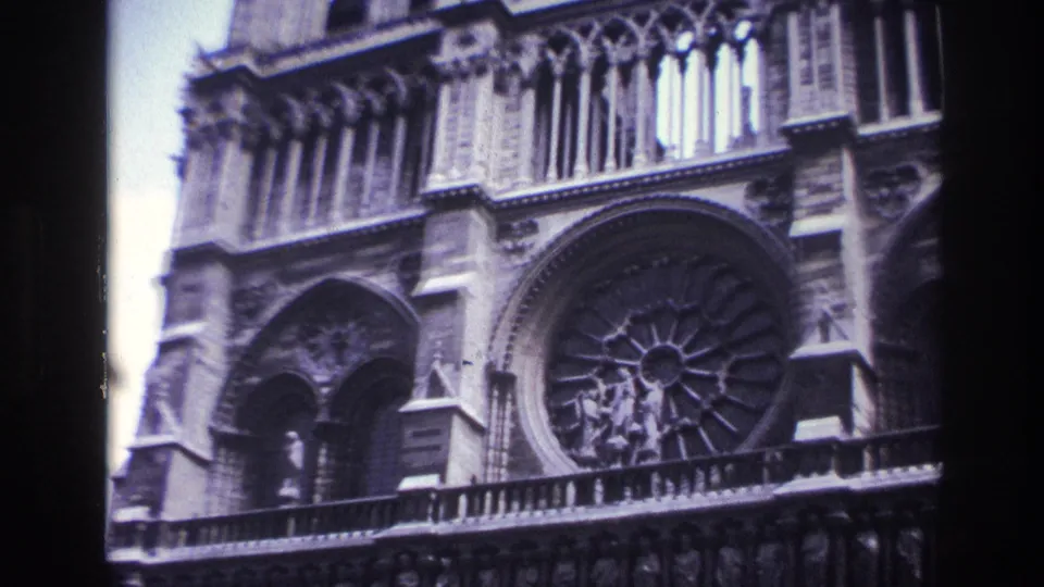 1967 Paris frame of Notre-Dame Cathedral exterior, centered on the rose window and surrounding Gothic arches.