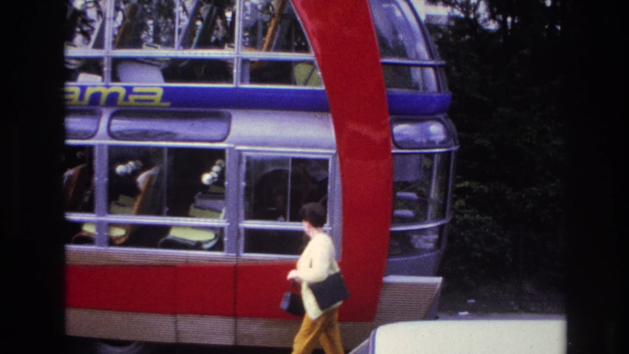 Red and silver double-decker bus with Cityrama lettering and a woman walking past.