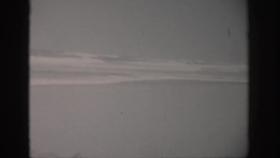 1959 Florida 8mm view of choppy ocean water with long white surf bands under a subdued sky.