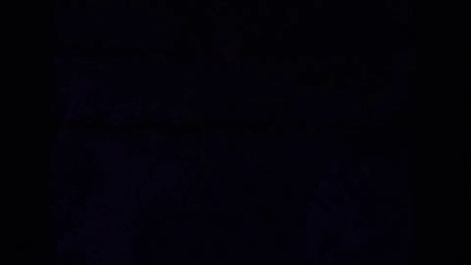 End of the 8mm clip falls into a dark, underexposed frame with only faint blue film texture visible.