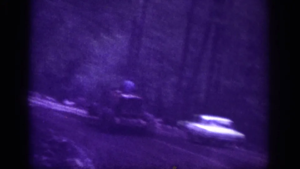 Continuation of the wooded dirt road shot, possibly Memphis Tennessee circa 1963; the blue object from the prior frame remains visible and unidentified.