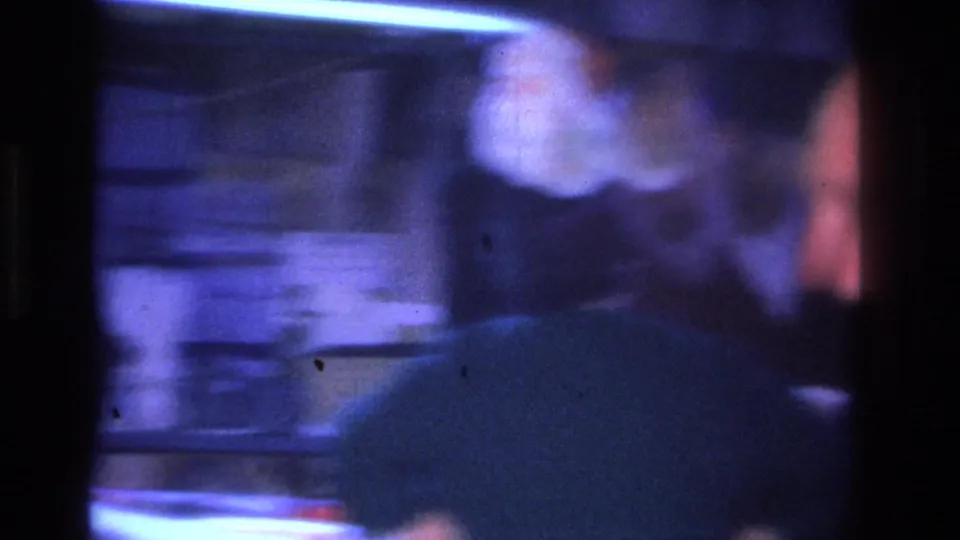 Camera pan from a 1966 Hoboken home movie showing severe motion blur and blue-purple color shift characteristic of 8mm panning under artificial indoor light.
