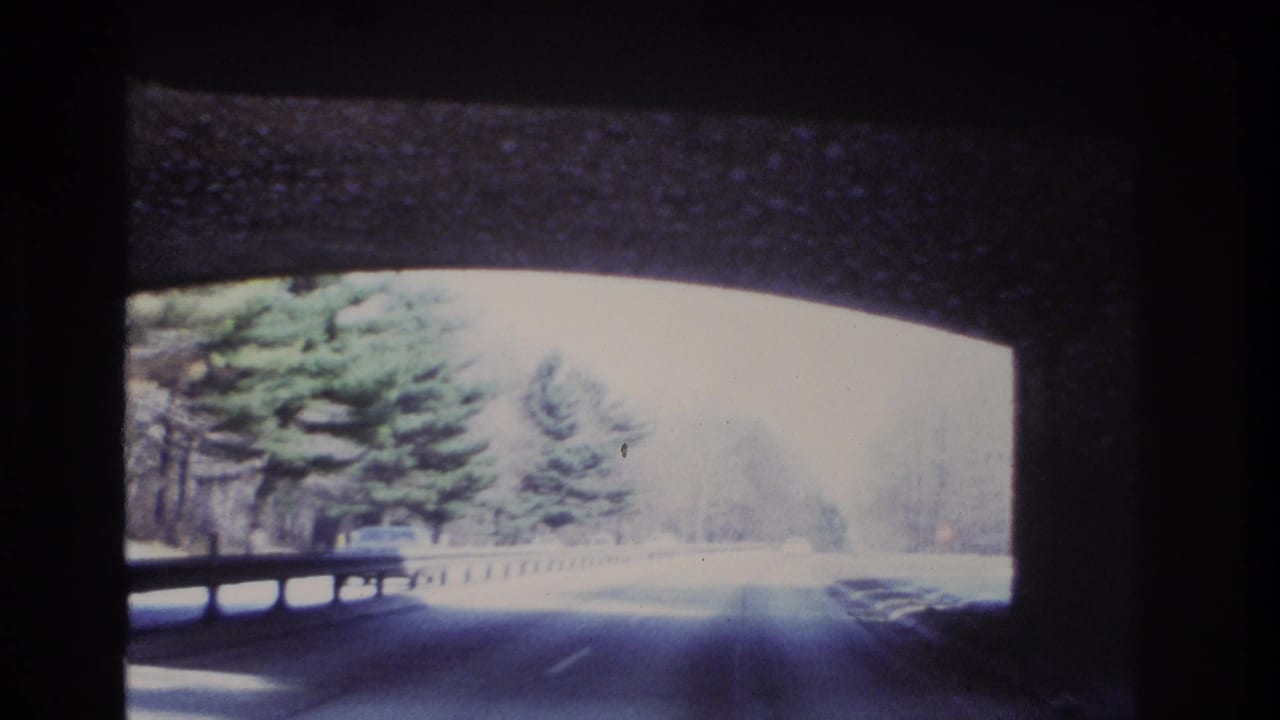 1966 8mm footage from inside a moving car passing under a stone arch bridge near Hoboken, New Jersey.