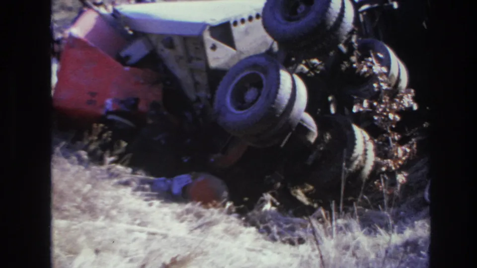1966 Hoboken wreck scene showing the truck cab area, raised wheels, and debris in the ditch.