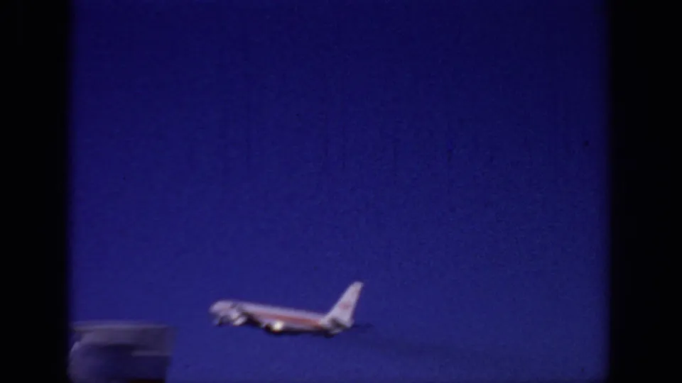 Final frame shows the TWA aircraft low in the frame, partly blurred as it continues climbing through the Sacramento sky.